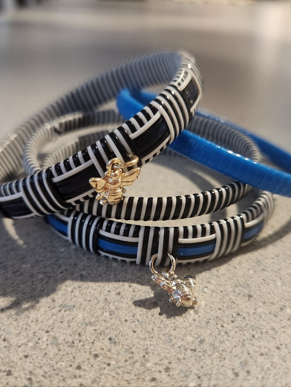 Striped Black & White and Blue Coil Bracelets with Bee Charms